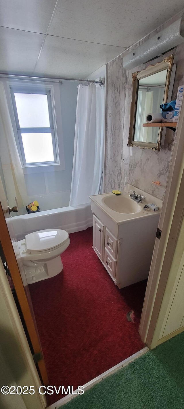 bathroom with vanity, shower / bath combo with shower curtain, and toilet