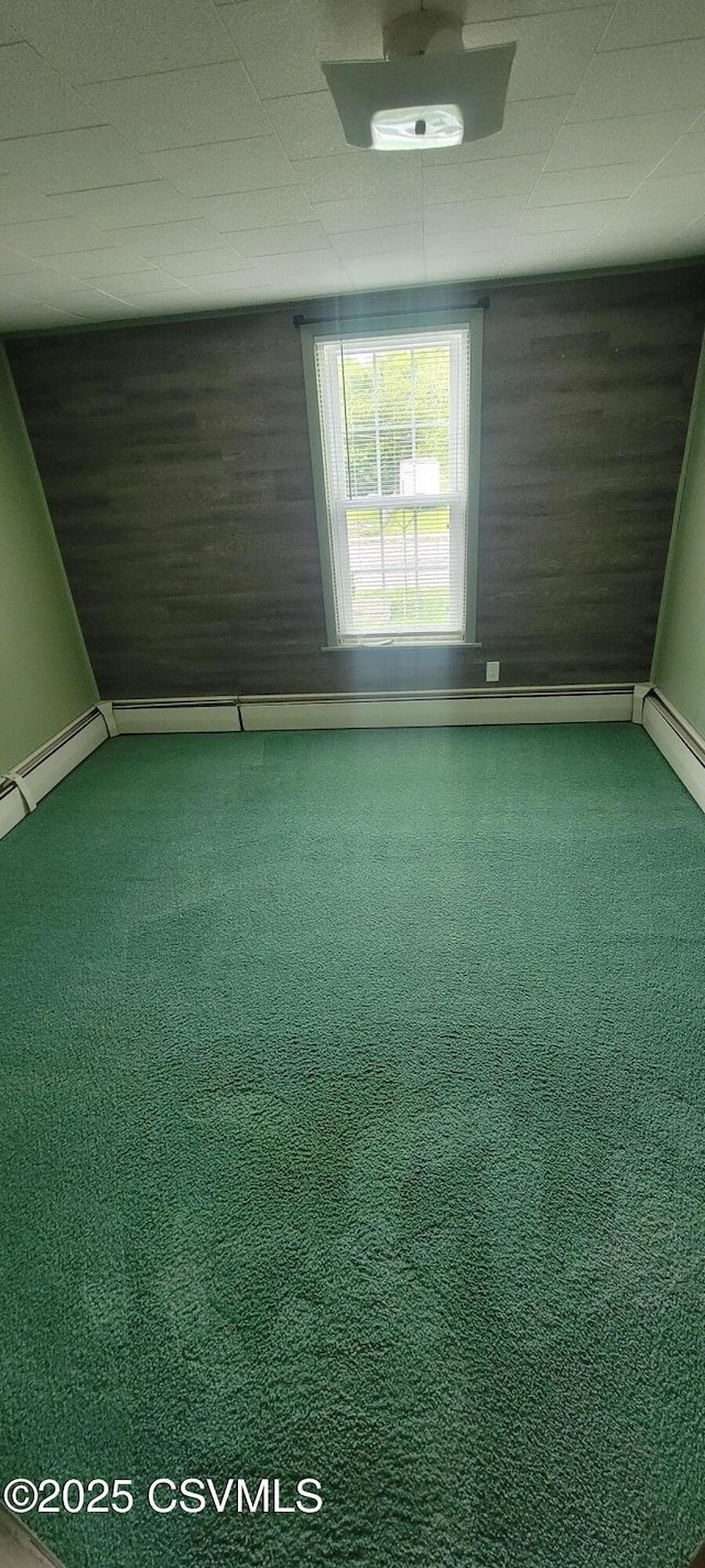 spare room with carpet floors and baseboards