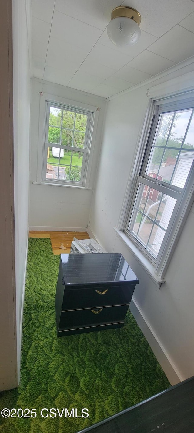 bedroom featuring wood finished floors and baseboards
