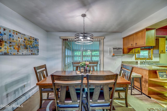 1030 Ruthann Dr, Berwick, PA 18603 - dining area with a baseboard heating unit, a chandelier, plenty of natural light, and light carpet