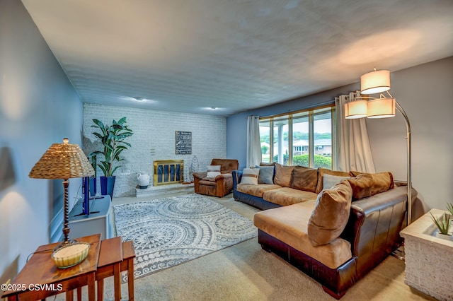 1030 Ruthann Dr, Berwick, PA 18603 - living room with carpet flooring, brick wall, and a fireplace