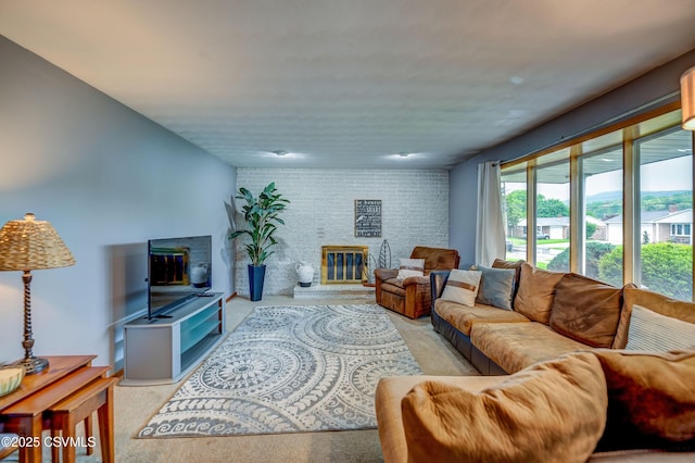 1030 Ruthann Dr, Berwick, PA 18603 - carpeted living room featuring a large fireplace and brick wall