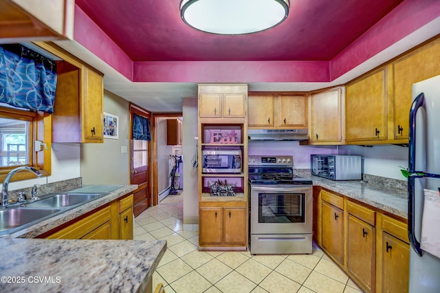 1030 Ruthann Dr, Berwick, PA 18603 - kitchen featuring stainless steel appliances, under cabinet range hood, a sink, light tile patterned floors, and brown cabinetry