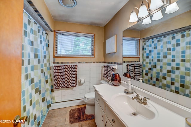 1030 Ruthann Dr, Berwick, PA 18603 - full bath featuring plenty of natural light, tile walls, tile patterned flooring, toilet, and vanity