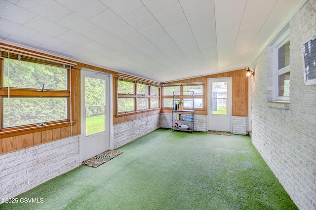 1030 Ruthann Dr, Berwick, PA 18603 - unfurnished sunroom featuring carpet, brick wall, and wooden walls