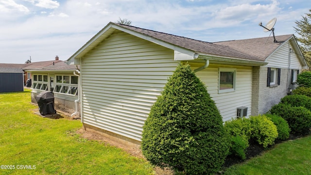 1030 Ruthann Dr, Berwick, PA 18603 - view of side of home featuring a yard, a shingled roof, and brick siding