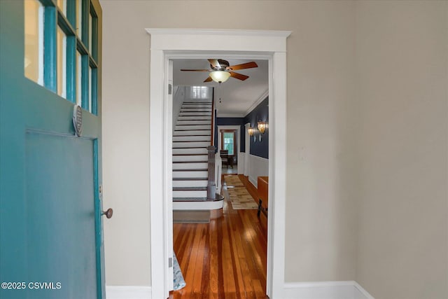 288 Broadway St, Turbotville, PA 17772 - hallway featuring stairs, hardwood / wood-style flooring, and crown molding