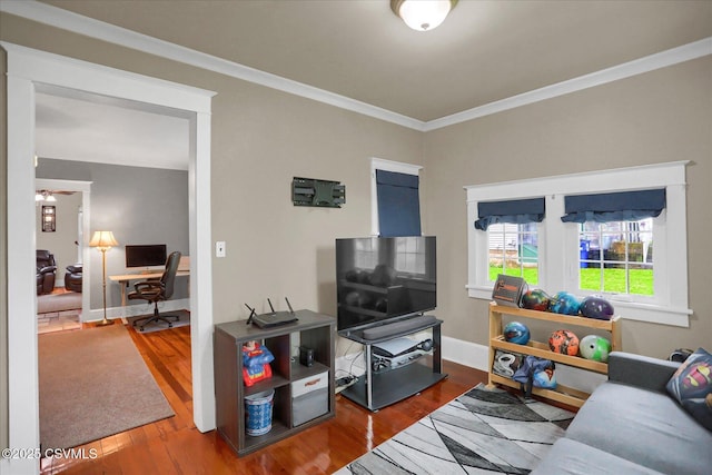 288 Broadway St, Turbotville, PA 17772 - living area featuring wood finished floors, a desk, crown molding, a ceiling fan, and baseboards