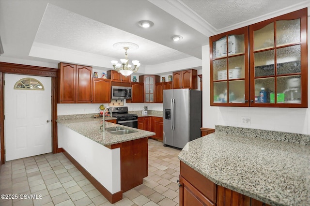 288 Broadway St, Turbotville, PA 17772 - kitchen with stainless steel appliances, a peninsula, a sink, a raised ceiling, and a chandelier