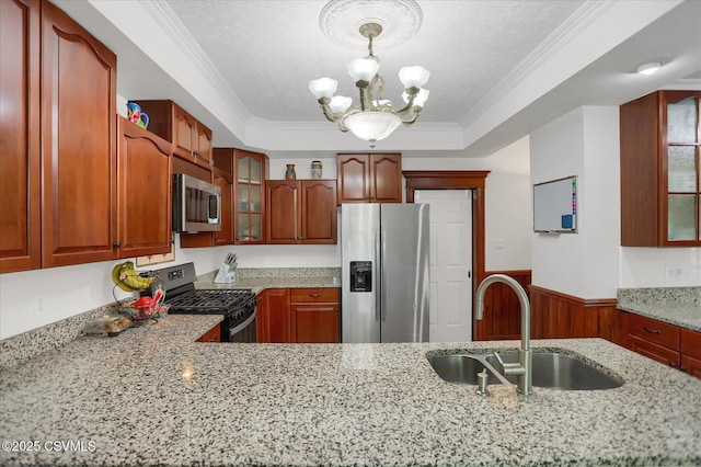 288 Broadway St, Turbotville, PA 17772 - kitchen featuring appliances with stainless steel finishes, a sink, a chandelier, light stone counters, and glass insert cabinets