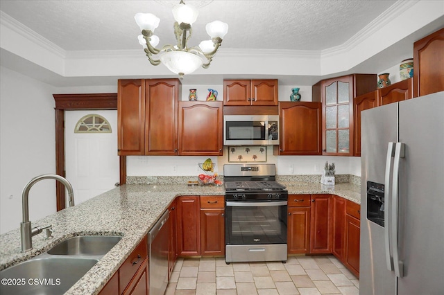 288 Broadway St, Turbotville, PA 17772 - kitchen featuring appliances with stainless steel finishes, a sink, a chandelier, light stone countertops, and ornamental molding