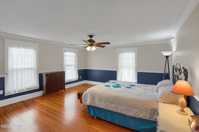 288 Broadway St, Turbotville, PA 17772 - bedroom featuring radiator heating unit, ornamental molding, hardwood / wood-style flooring, ceiling fan, and baseboards