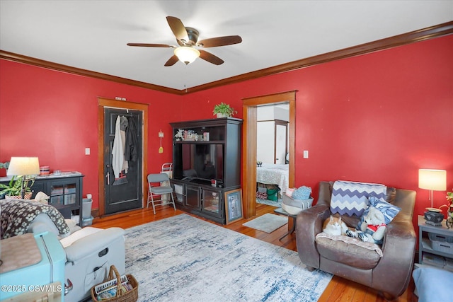288 Broadway St, Turbotville, PA 17772 - living room featuring wood finished floors, a ceiling fan, and ornamental molding