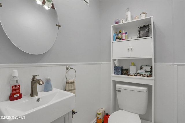 288 Broadway St, Turbotville, PA 17772 - half bathroom with wainscoting, toilet, and vanity