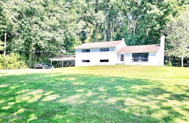 43 Red Oak Dr, Danville, PA 17821 - view of front facade featuring a front lawn and a chimney
