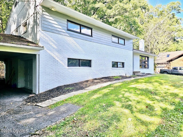 43 Red Oak Dr, Danville, PA 17821 - view of side of home with brick siding and a yard