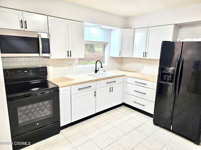 43 Red Oak Dr, Danville, PA 17821 - kitchen with black appliances, a sink, white cabinetry, and decorative backsplash