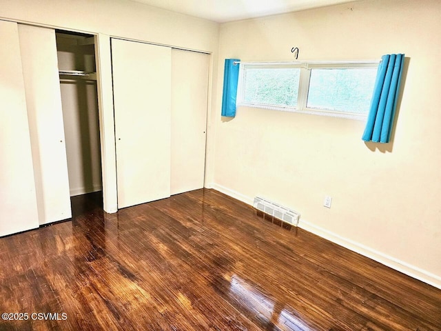43 Red Oak Dr, Danville, PA 17821 - unfurnished bedroom featuring wood finished floors, multiple closets, and baseboards