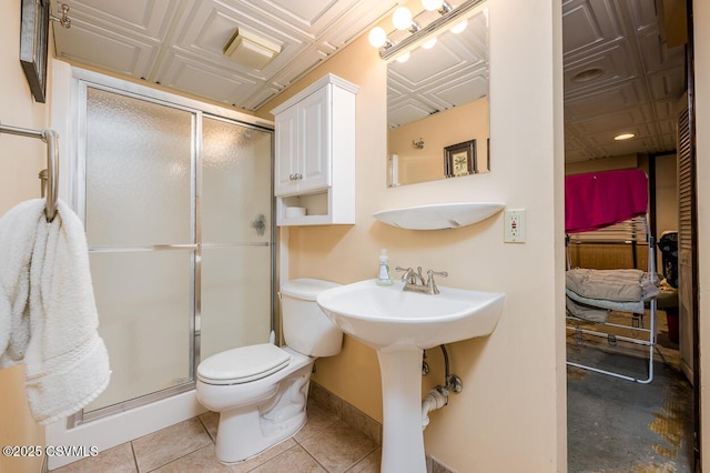 937 E 10th St, Berwick, PA 18603 - ensuite bathroom featuring toilet, a stall shower, baseboards, tile patterned flooring, and an ornate ceiling