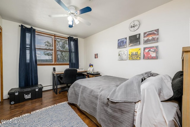 937 E 10th St, Berwick, PA 18603 - bedroom with wood finished floors, baseboard heating, a ceiling fan, and a desk