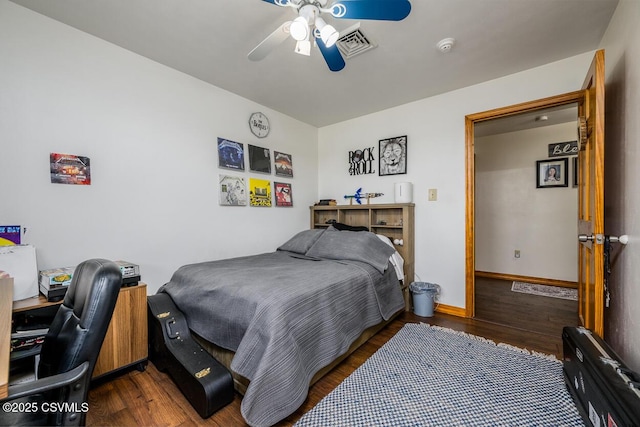 937 E 10th St, Berwick, PA 18603 - bedroom with dark wood-style flooring, ceiling fan, baseboards, and a desk