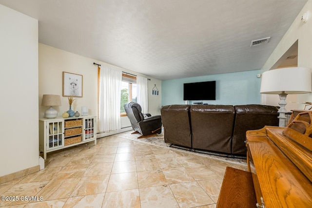 937 E 10th St, Berwick, PA 18603 - living room with a baseboard heating unit