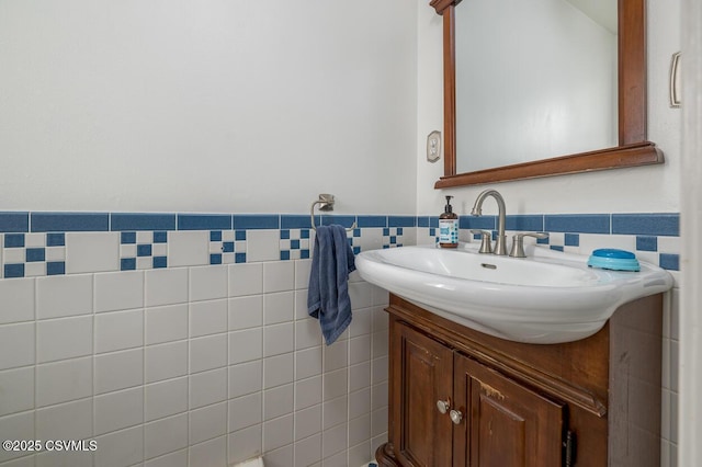 937 E 10th St, Berwick, PA 18603 - bathroom with vanity, tile walls, and a wainscoted wall
