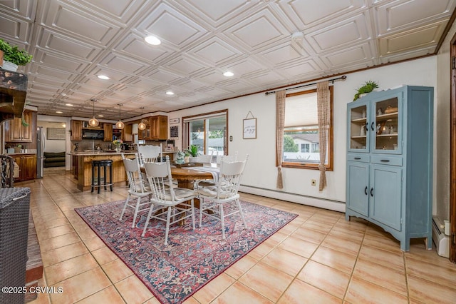 937 E 10th St, Berwick, PA 18603 - dining area with baseboard heating, recessed lighting, light tile patterned floors, and an ornate ceiling