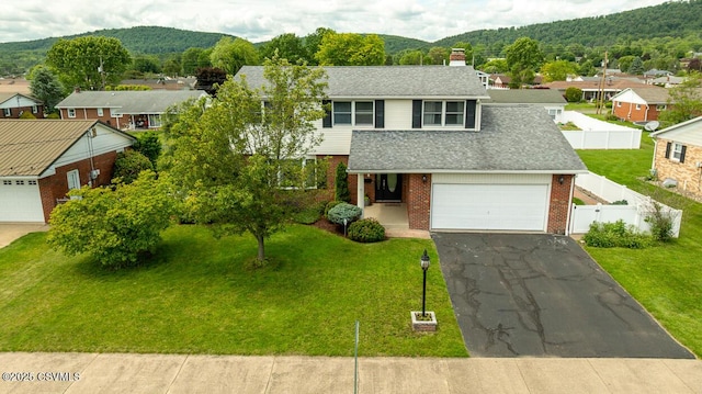937 E 10th St, Berwick, PA 18603 - view of front facade with brick siding, a mountain view, a chimney, and driveway
