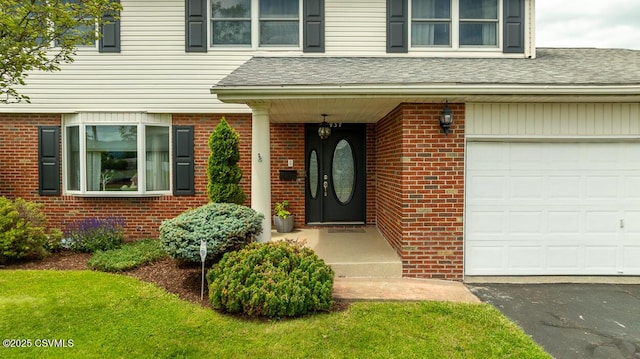 937 E 10th St, Berwick, PA 18603 - doorway to property with brick siding, driveway, and roof with shingles