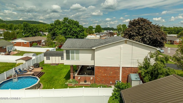 937 E 10th St, Berwick, PA 18603 - back of house with brick siding, a shingled roof, and a residential view