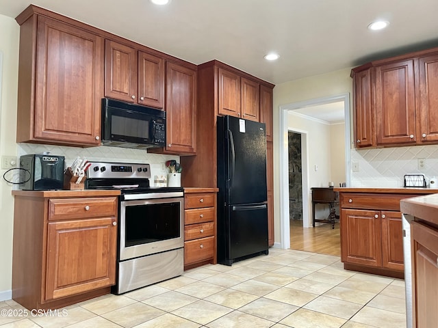 3014 Smoketown Rd, Lewisburg, PA 17837 - kitchen featuring black appliances, tasteful backsplash, recessed lighting, crown molding, and light tile patterned flooring