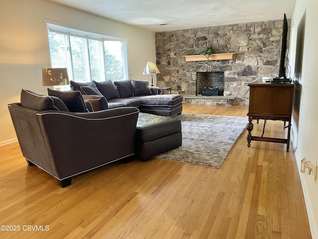 3014 Smoketown Rd, Lewisburg, PA 17837 - living area featuring wood finished floors and a stone fireplace