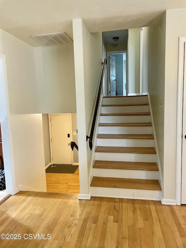 3014 Smoketown Rd, Lewisburg, PA 17837 - staircase with hardwood / wood-style floors and baseboards