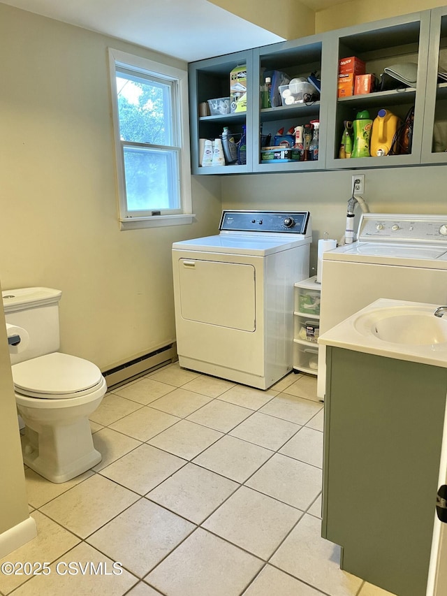 3014 Smoketown Rd, Lewisburg, PA 17837 - laundry area featuring a baseboard heating unit, independent washer and dryer, and light tile patterned floors