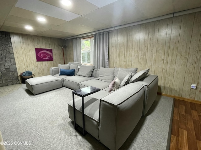3014 Smoketown Rd, Lewisburg, PA 17837 - living room featuring wood finished floors, a paneled ceiling, wooden walls, and baseboards