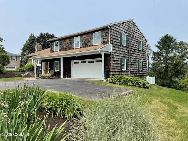 3014 Smoketown Rd, Lewisburg, PA 17837 - view of front of house with asphalt driveway, an attached garage, and a chimney