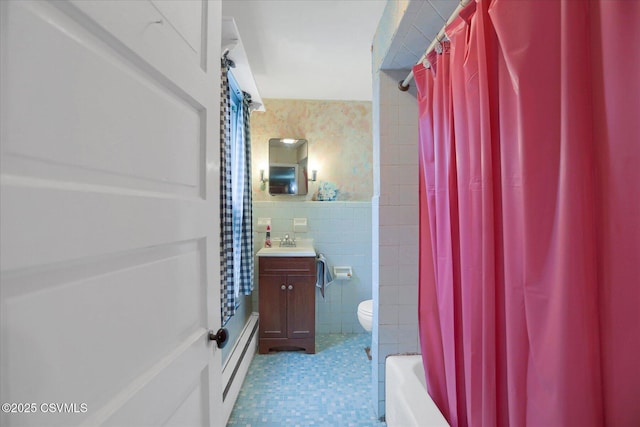 205 N Water St, Selinsgrove, PA 17870 - bathroom with tile walls, shower / bath combination with curtain, vanity, toilet, and tile patterned floors
