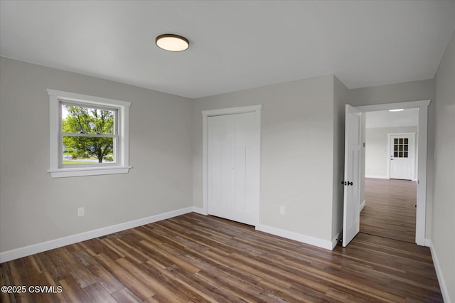 2196 Continental Blvd, Danville, PA 17821 - unfurnished bedroom with dark wood-type flooring, baseboards, and a closet