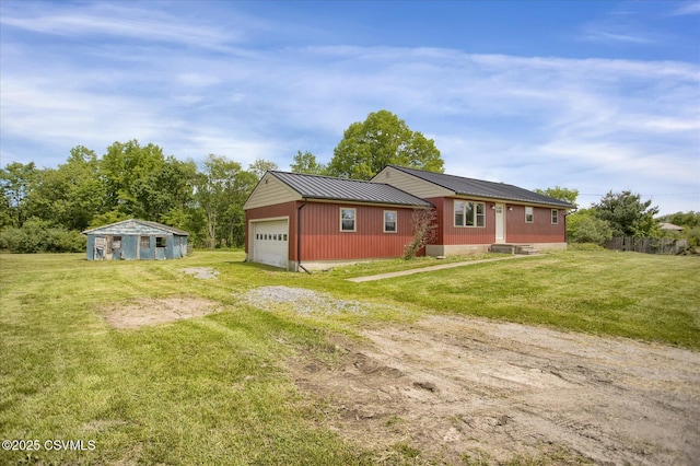 2196 Continental Blvd, Danville, PA 17821 - view of front of property with an attached garage, driveway, a front yard, and metal roof