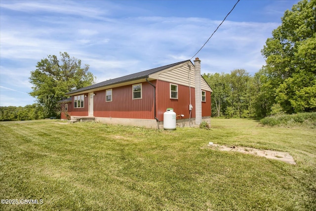 2196 Continental Blvd, Danville, PA 17821 - view of property exterior featuring a chimney and a lawn