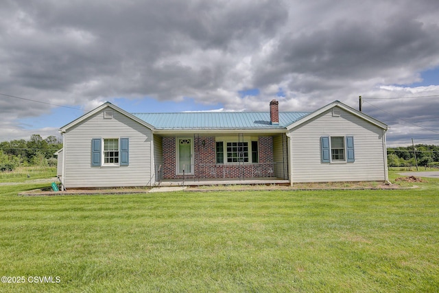 4123 Troxelville Rd, Middleburg, PA 17842 - single story home with a porch, a chimney, a front yard, and metal roof