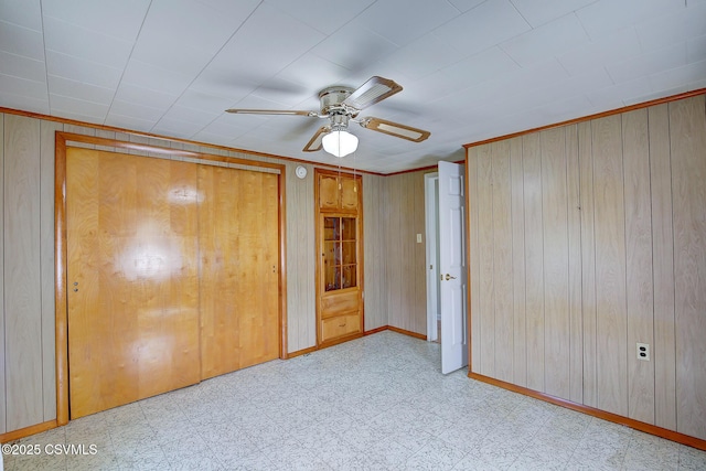 4123 Troxelville Rd, Middleburg, PA 17842 - unfurnished bedroom featuring wooden walls, tile patterned floors, baseboards, and a ceiling fan