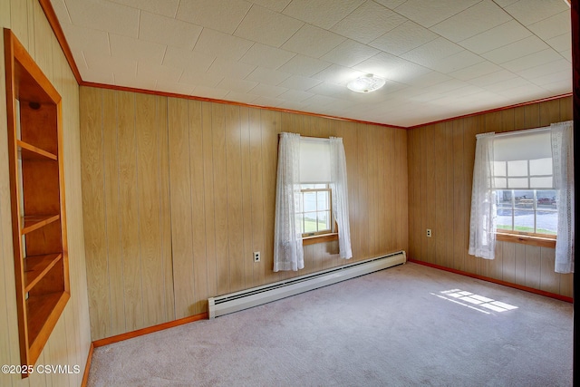 4123 Troxelville Rd, Middleburg, PA 17842 - unfurnished room with baseboard heating, carpet floors, wood walls, and baseboards