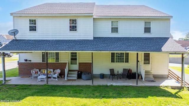 1597 N Mulberry St, Berwick, PA 18603 - rear view of property with entry steps, a lawn, roof with shingles, and a patio