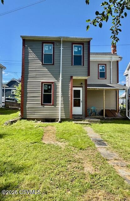 833 Line St, Sunbury, PA 17801 - rear view of property with a lawn and a chimney