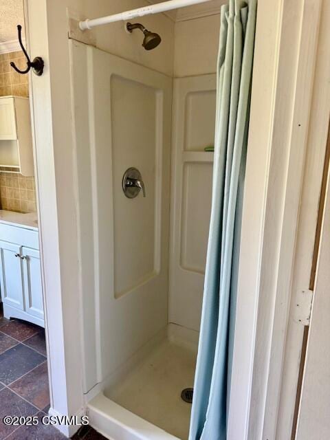 833 Line St, Sunbury, PA 17801 - bathroom featuring a stall shower, vanity, tasteful backsplash, and stone finish floors