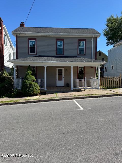 833 Line St, Sunbury, PA 17801 - view of front of house featuring covered porch and a chimney