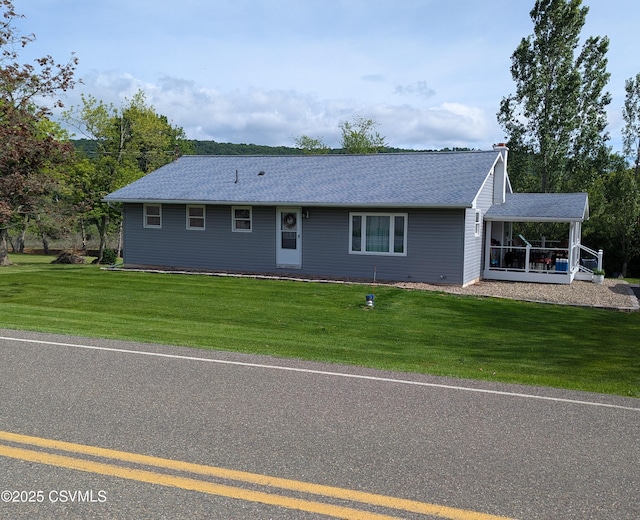 724 Frosty Valley Rd, Danville, PA 17821 - ranch-style house with a front lawn and roof with shingles