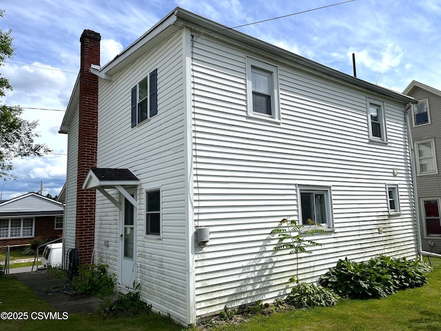 433 E 6th St, Berwick, PA 18603 - view of side of home with a chimney